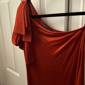 Off shoulder one side with beautiful detail.  Burnt orange color. Like new